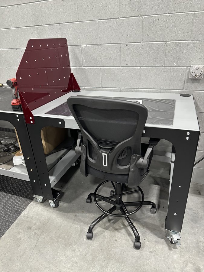Ergonomic industrial assembly workbench with task lighting and tool rails