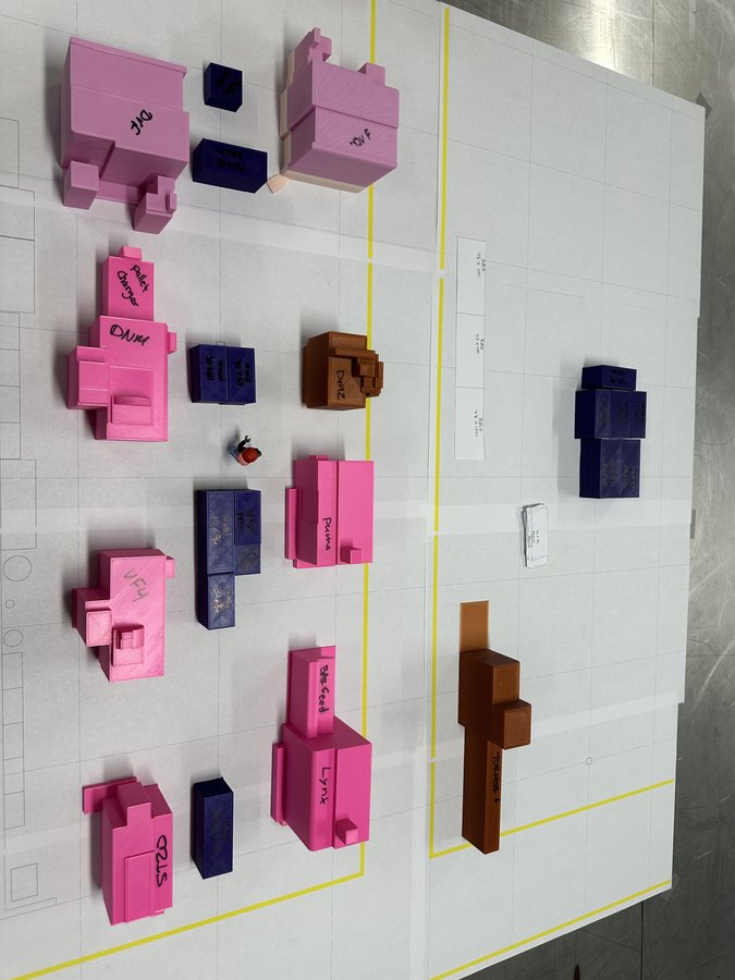 Machinery layout with material flow arrows on facility blueprint grid
