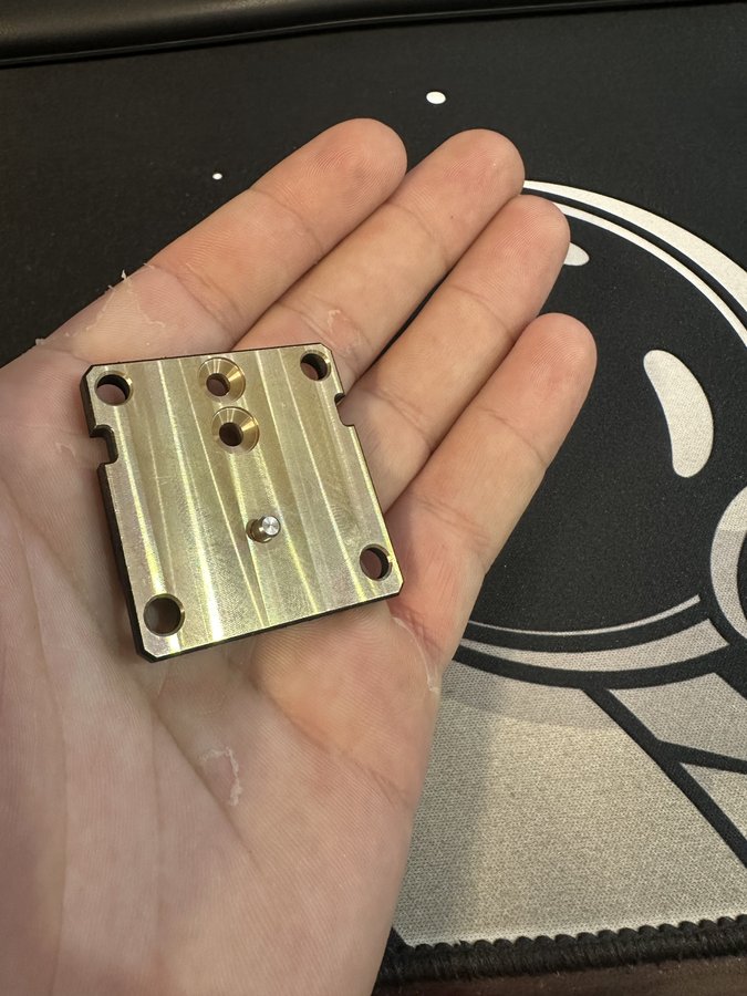 Precision milled bronze plate with dowel pin and countersunk holes