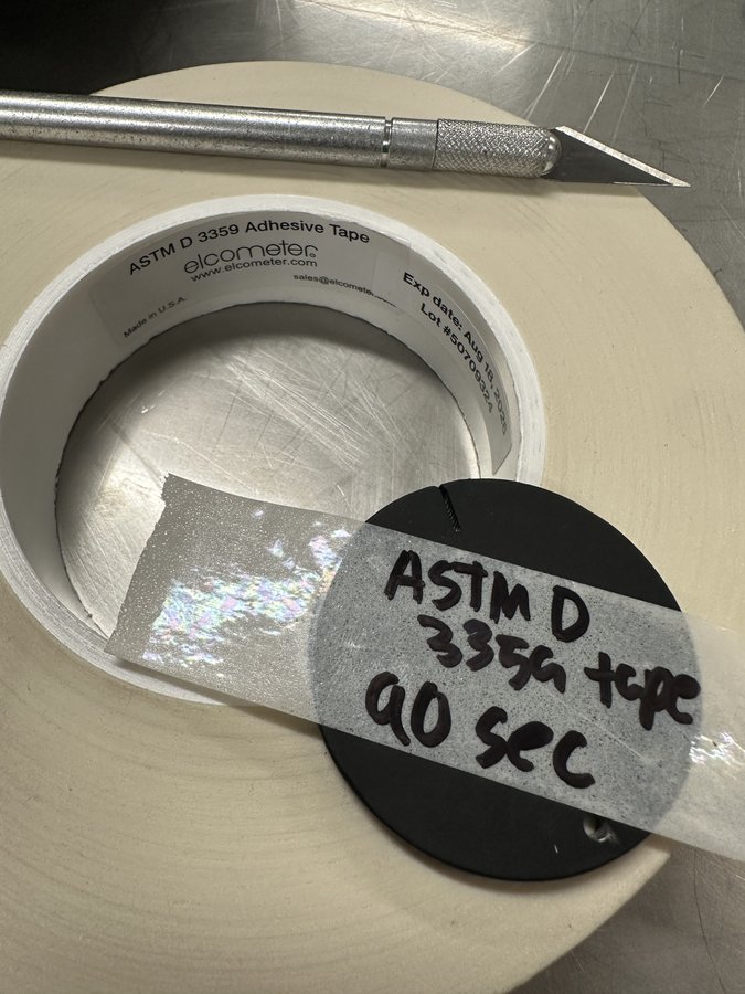 Cross hatch coating adhesion inspection coupon with Elcometer tape