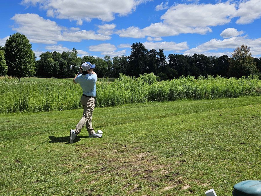 Anthony Aughenbaugh golfing outdoors